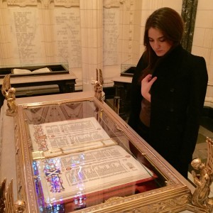 Yulia looks at a World War II-era Book of the Dead.